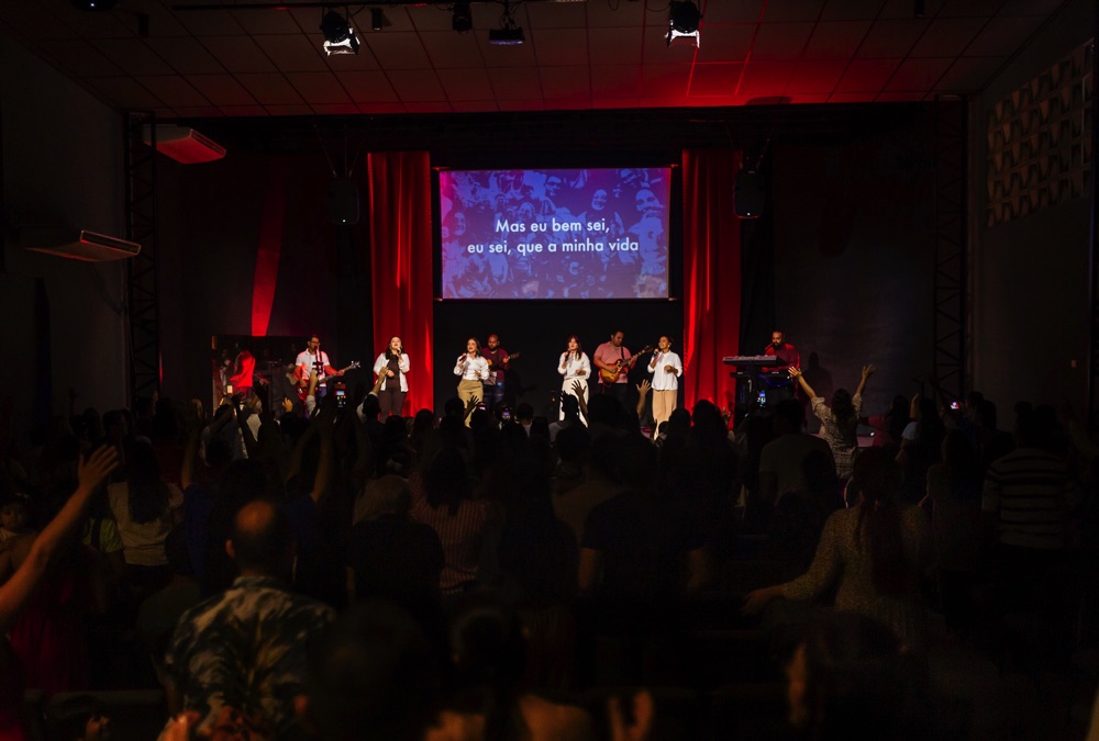 People watching a concert. Photo with a purple hue